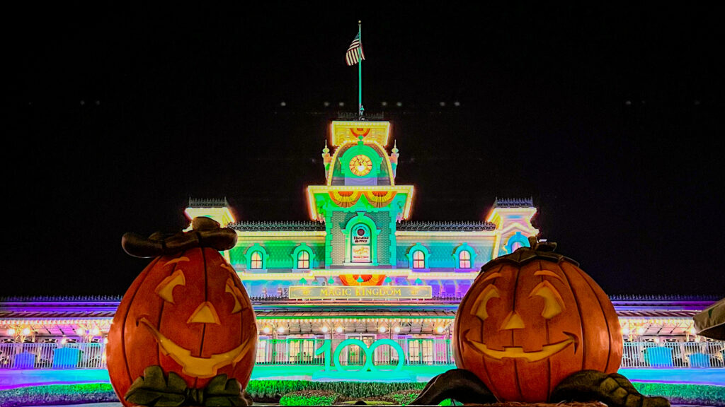 Magic Kingdom Entrance with 100 logo and halloween decorations